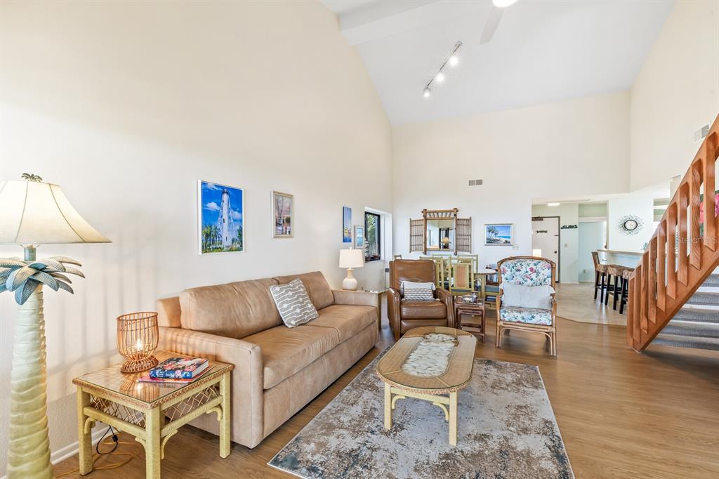 5000 Gasparilla Road, Unit 76B Boca Grande, FL 33921 - Photo 8 of 44 a living room with furniture and wooden floor
