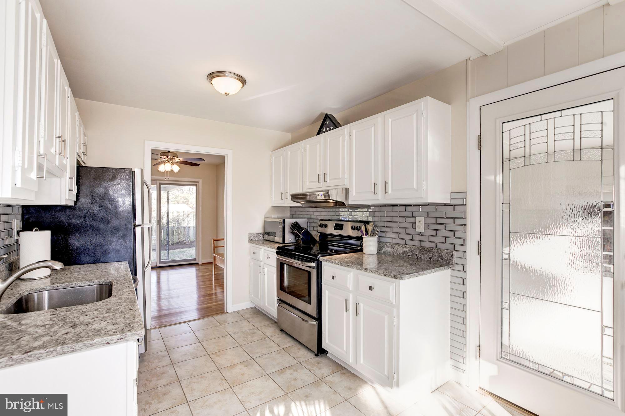 717 Carter Road Rockville, MD 20852 - Photo 8 of 26 Kitchen with access to garage and driveway