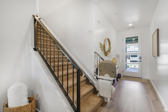 1705 Ripple Rock Drive, Unit 3017 Washington, UT 84780 - Photo 15 of 22 Staircase with carpeted treads and black metal railings