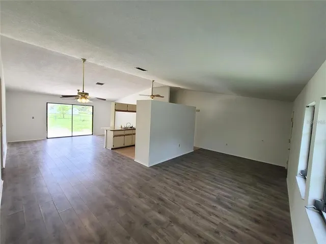 a view of a kitchen with a dishwasher and a ceiling fan