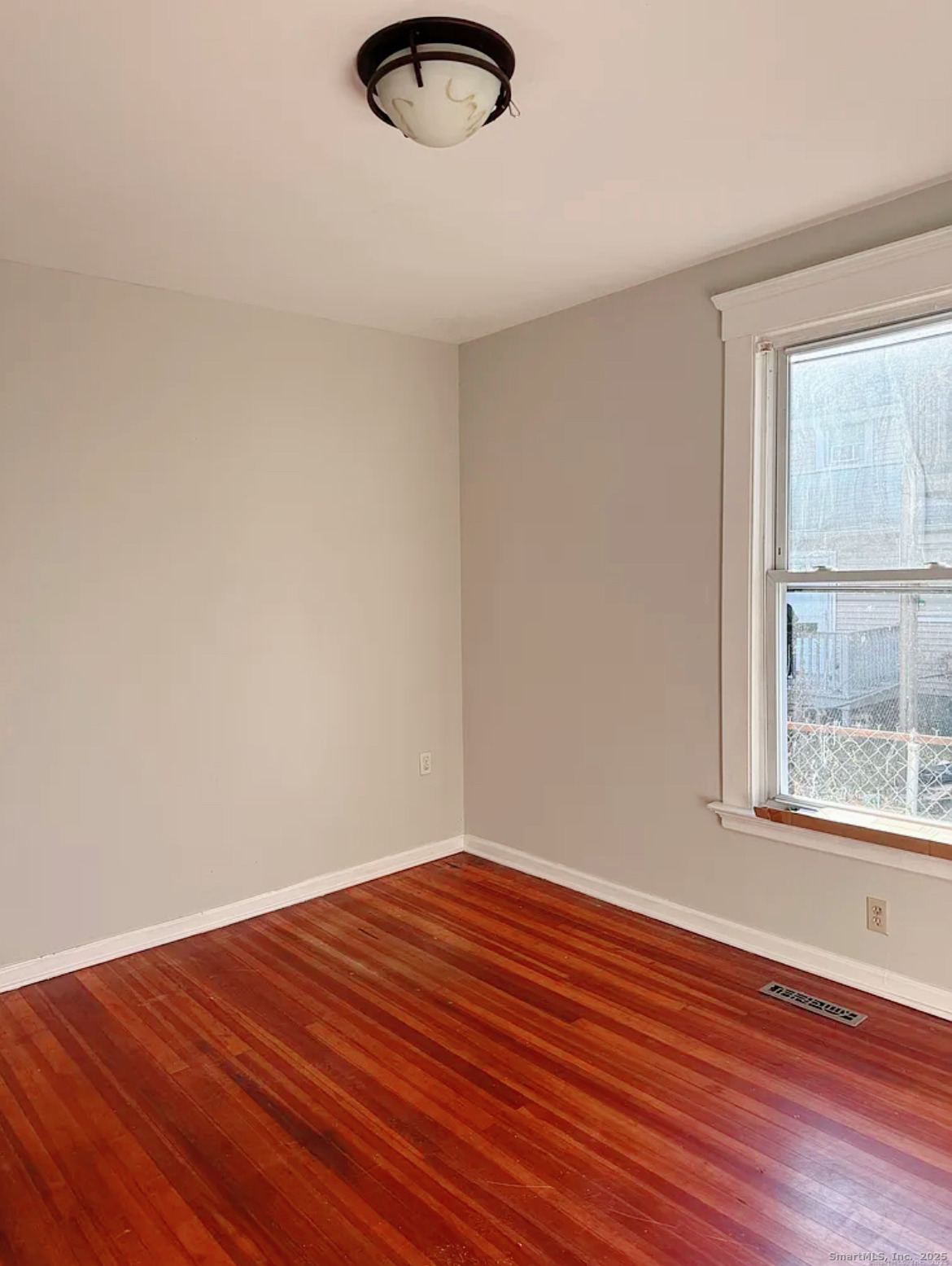 82 1st Street New Haven, CT 06519 - Photo 11 of 40 an empty room with wooden floor and windows