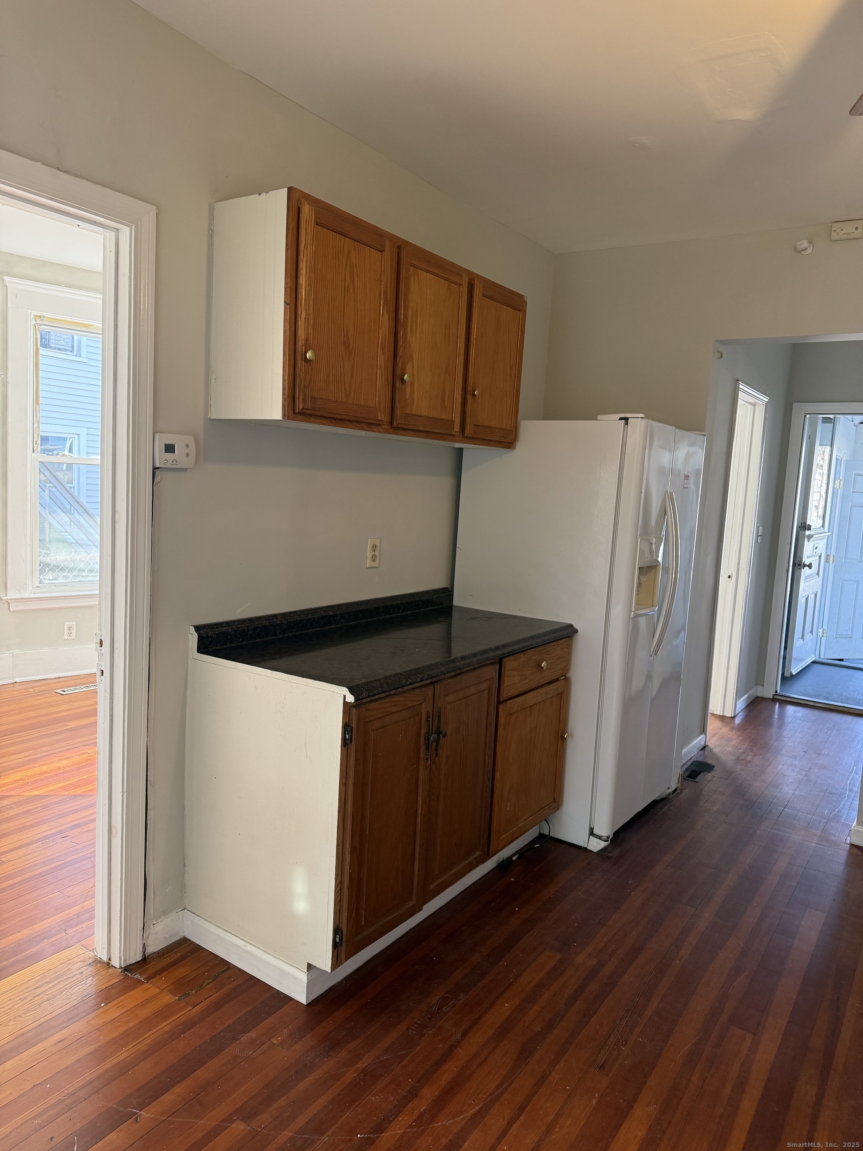 82 1st Street New Haven, CT 06519 - Photo 16 of 40 a view of a kitchen with wooden floor and electronic appliances
