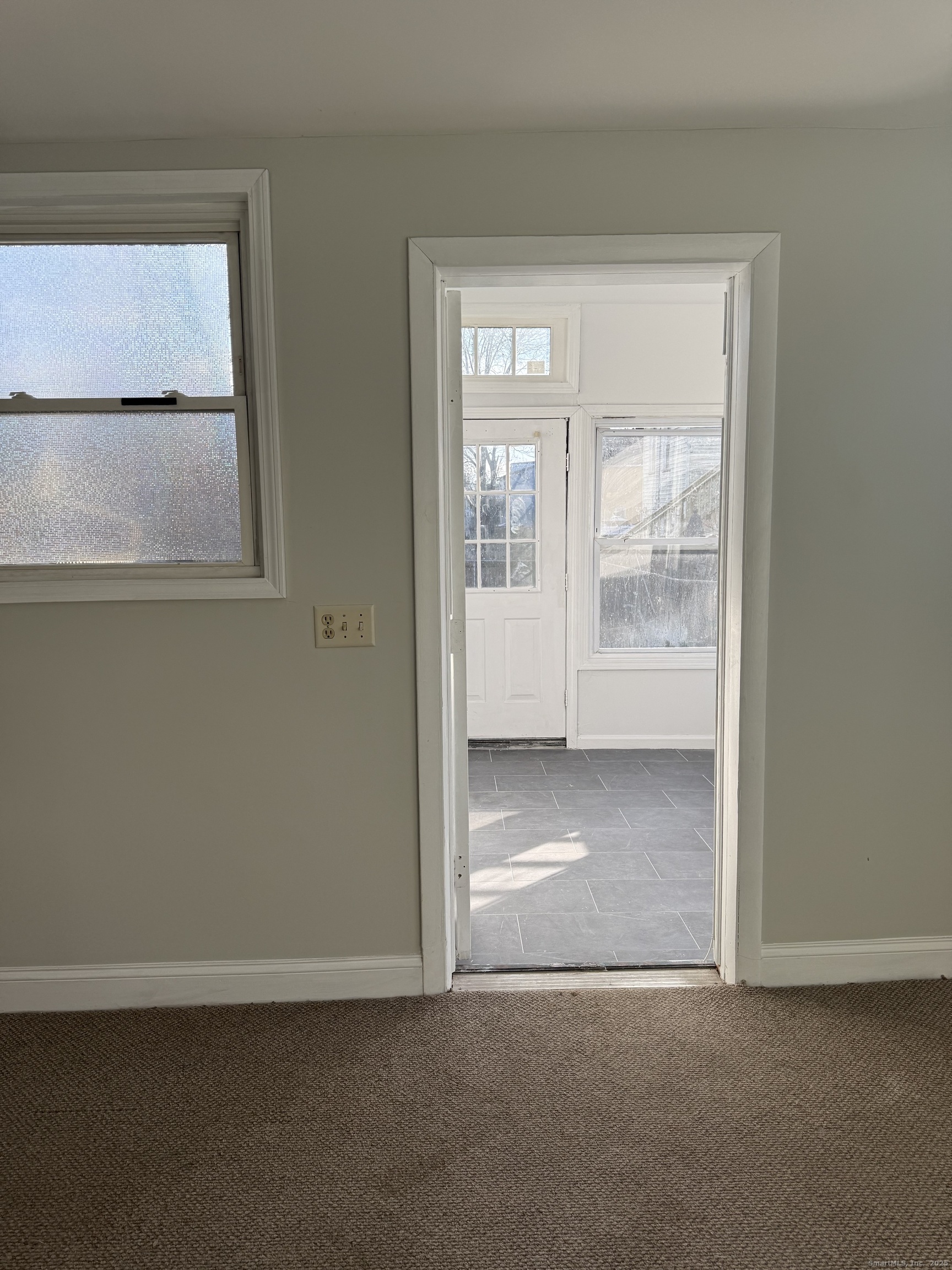 82 1st Street New Haven, CT 06519 - Photo 19 of 40 a view of an empty room with a window