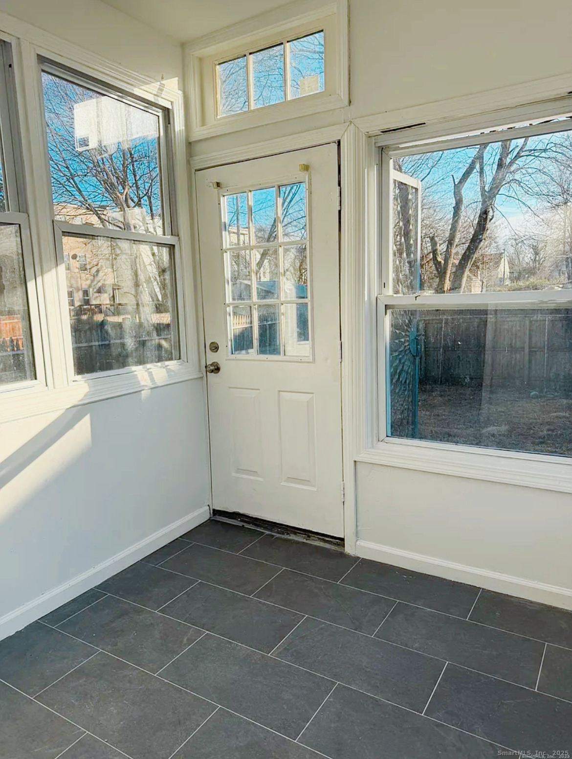 82 1st Street New Haven, CT 06519 - Photo 21 of 40 a view of an empty room with a window