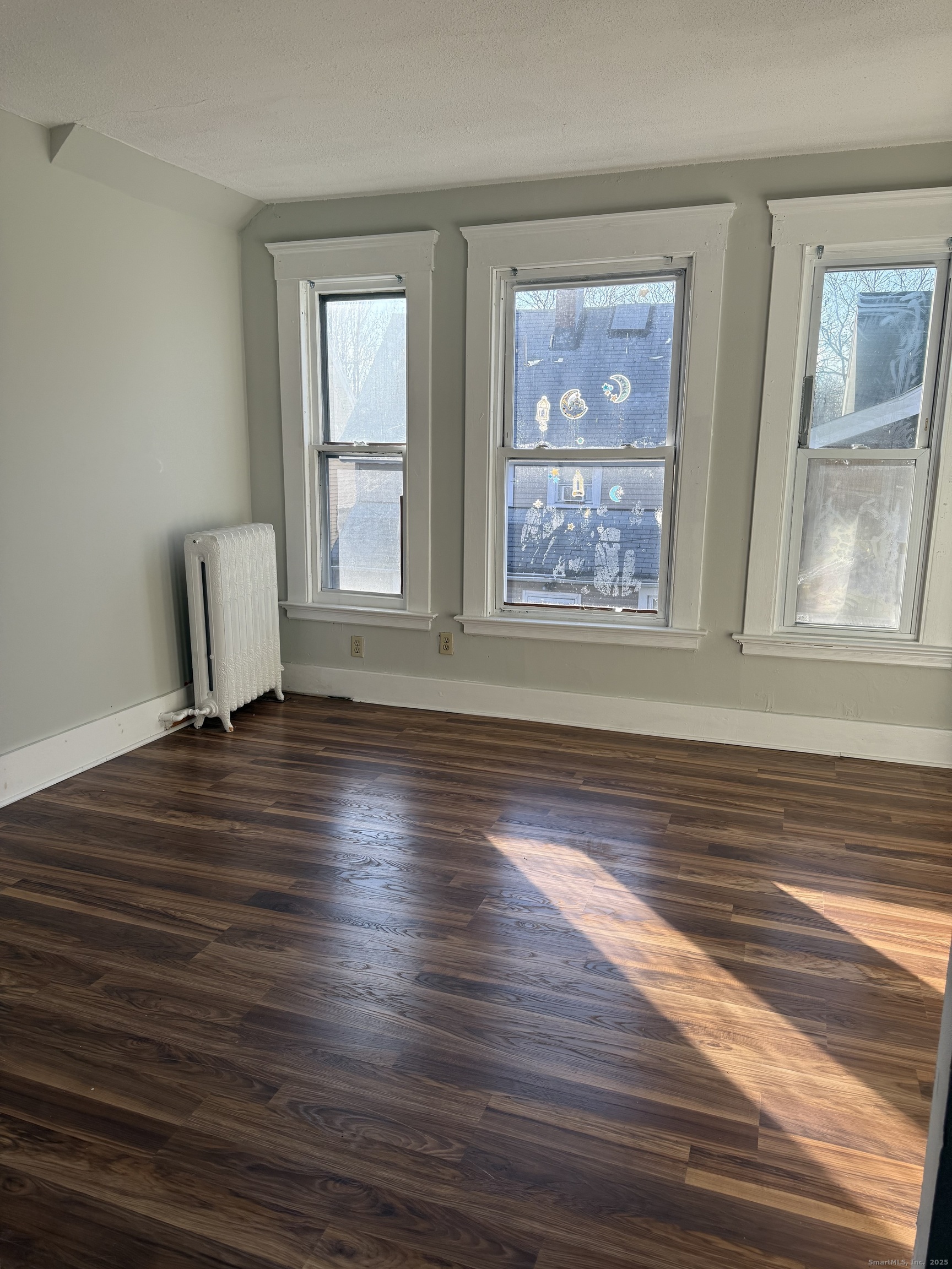 82 1st Street New Haven, CT 06519 - Photo 27 of 40 a view of a room with wooden floor and a window