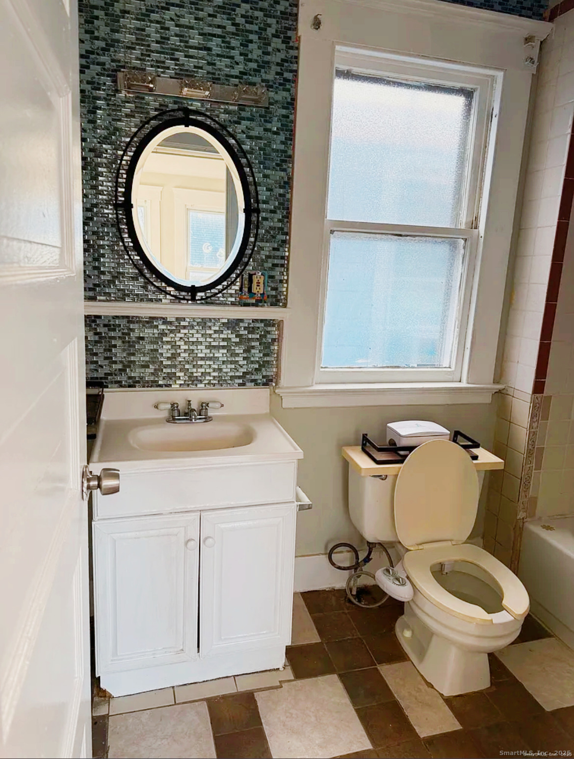 82 1st Street New Haven, CT 06519 - Photo 32 of 40 a bathroom with a toilet mirror vanity and a sink
