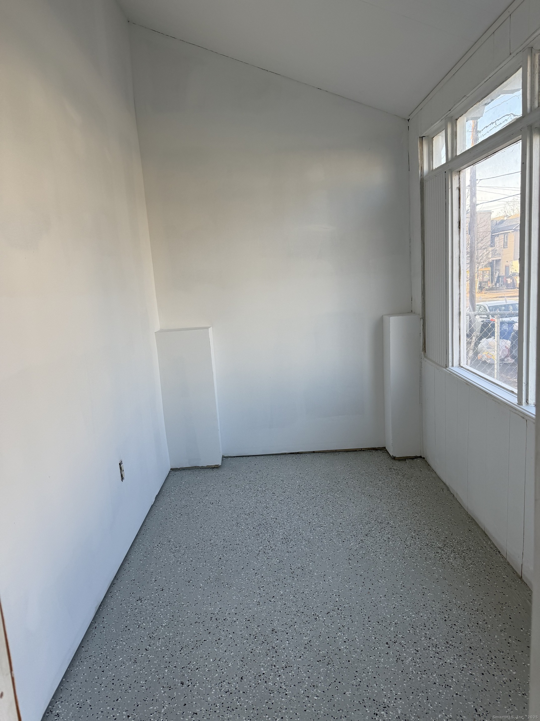 82 1st Street New Haven, CT 06519 - Photo 9 of 40 an empty room with windows