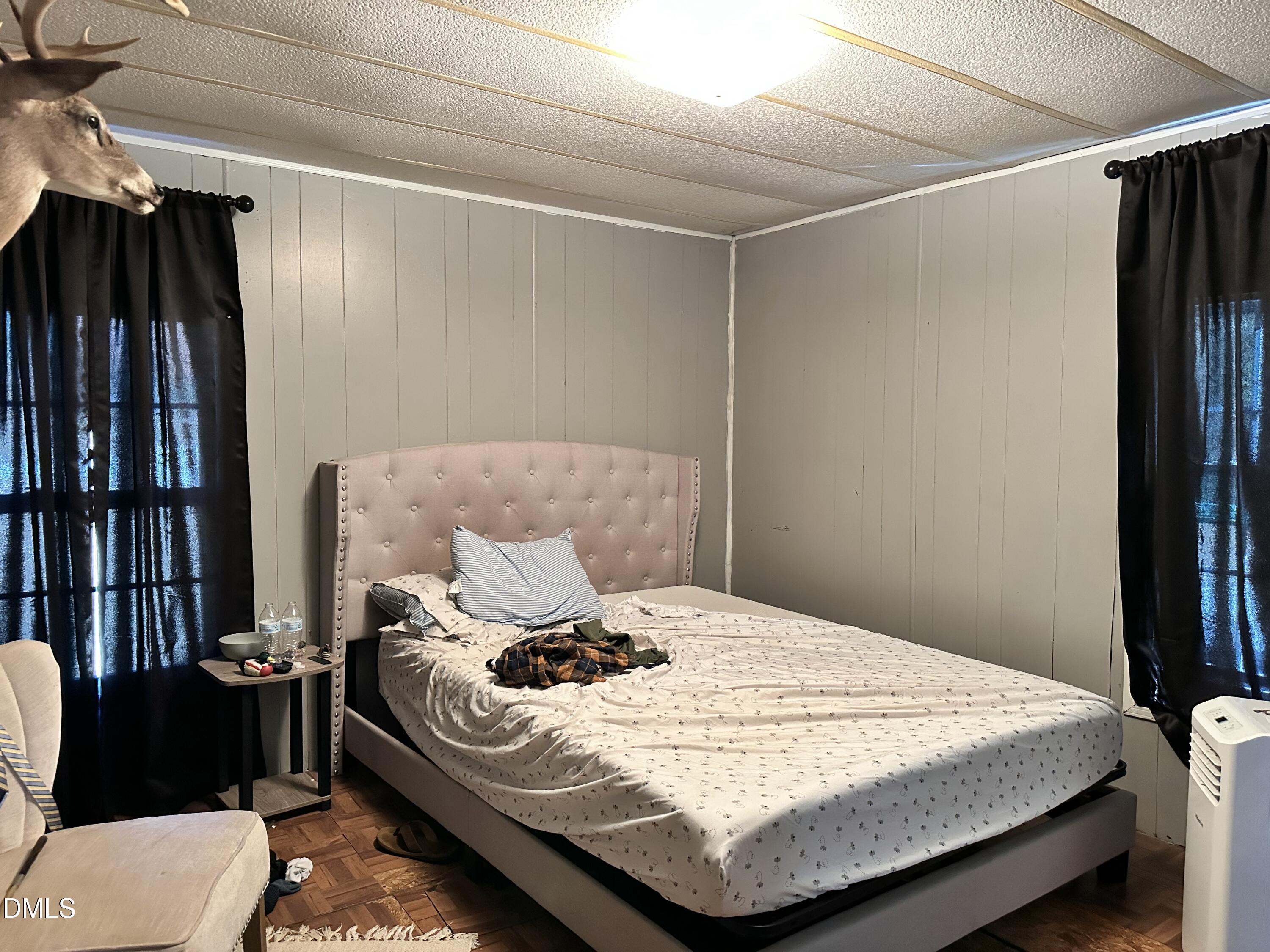 3263 Fleming Graham Road Burlington, NC 27217 - Photo 12 of 15 a bedroom with a bed and a window