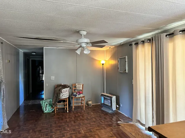 a view of a hallway with seating area