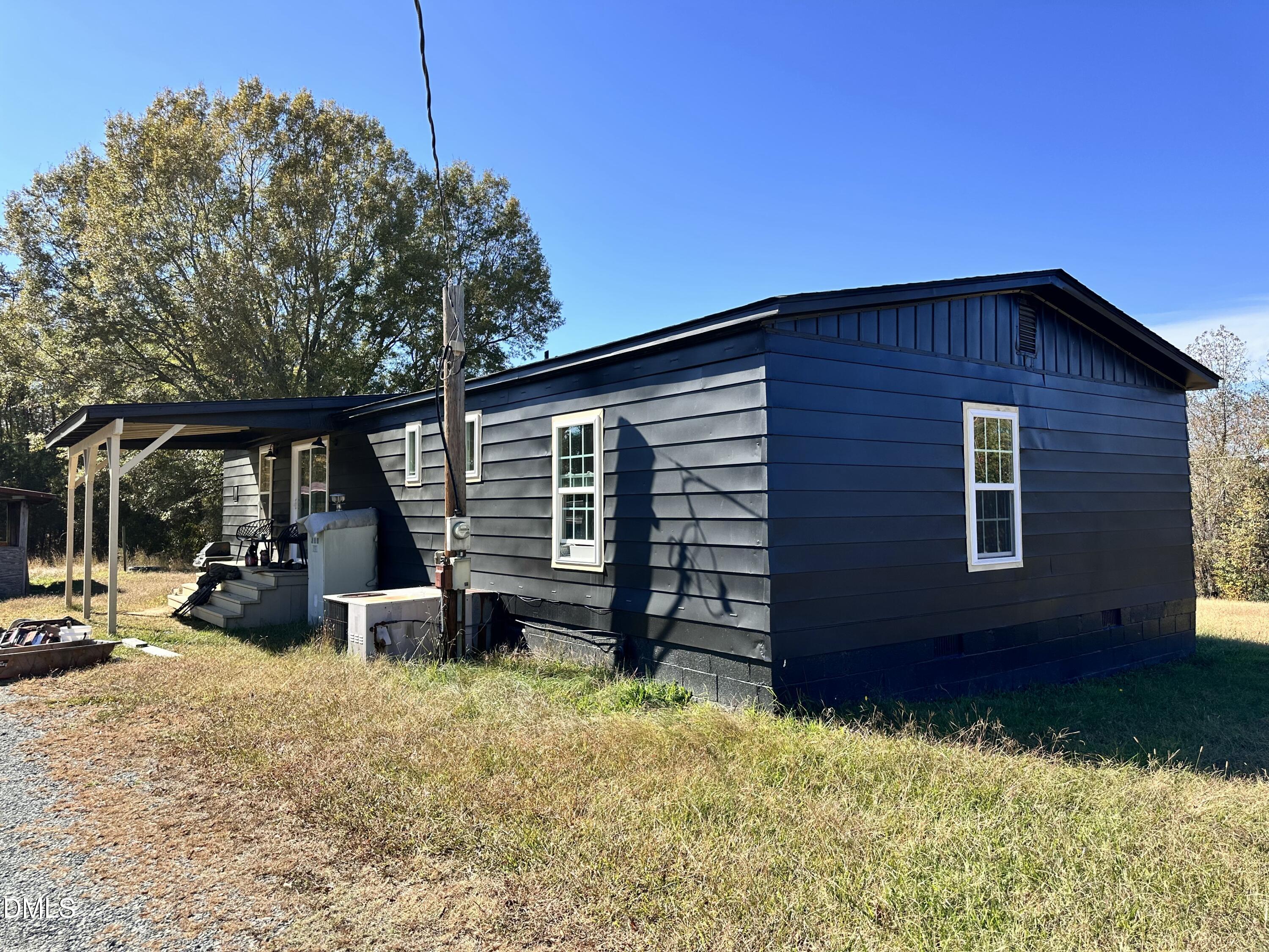 3263 Fleming Graham Road Burlington, NC 27217 - Photo 4 of 15 a view of house with backyard and seating area