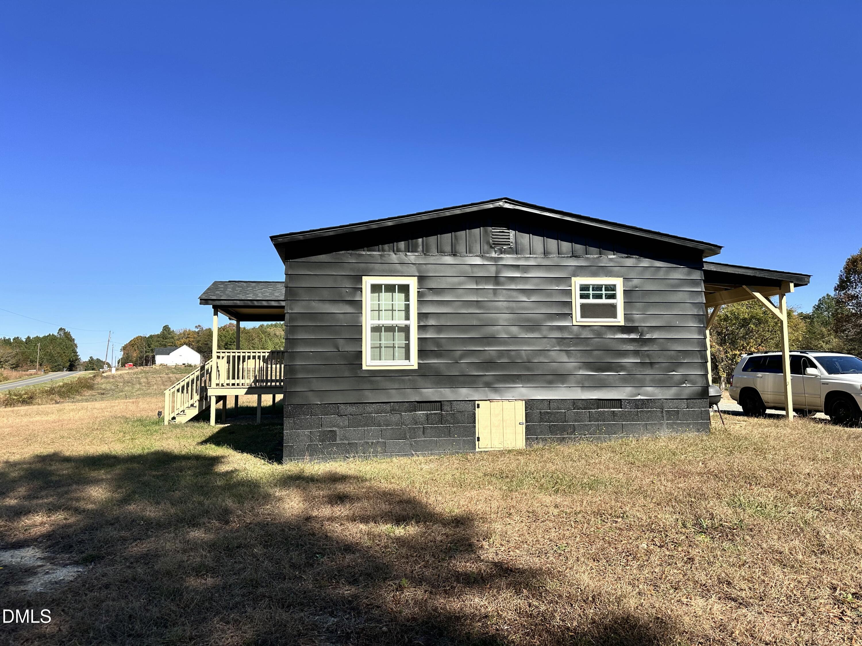 3263 Fleming Graham Road Burlington, NC 27217 - Photo 7 of 15 a front view of a house with a yard