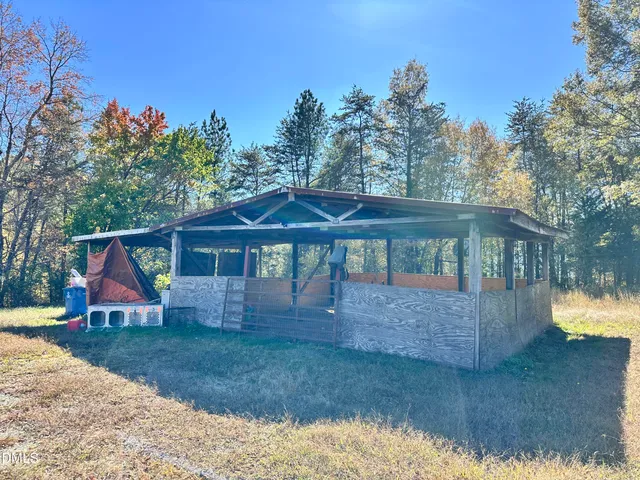 swimming pool view with a seating space