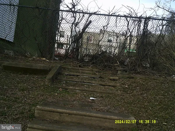 a view of backyard with green space