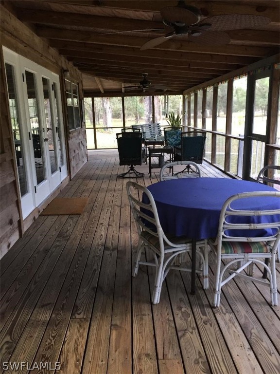 3031 Packinghouse Road Alva, FL 33920 - Photo 13 of 24 a view of a chairs and table on the deck