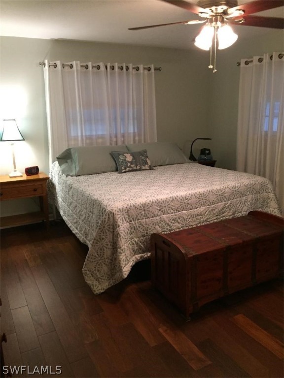 3031 Packinghouse Road Alva, FL 33920 - Photo 14 of 24 a bedroom with a bed and a chandelier