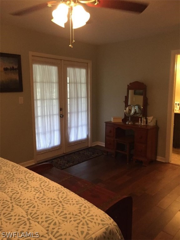3031 Packinghouse Road Alva, FL 33920 - Photo 15 of 24 a bedroom with a bed and a chandelier