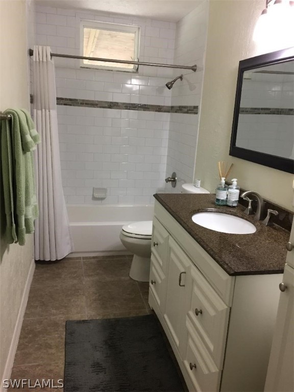 3031 Packinghouse Road Alva, FL 33920 - Photo 19 of 24 a bathroom with a granite countertop sink a toilet a mirror and shower