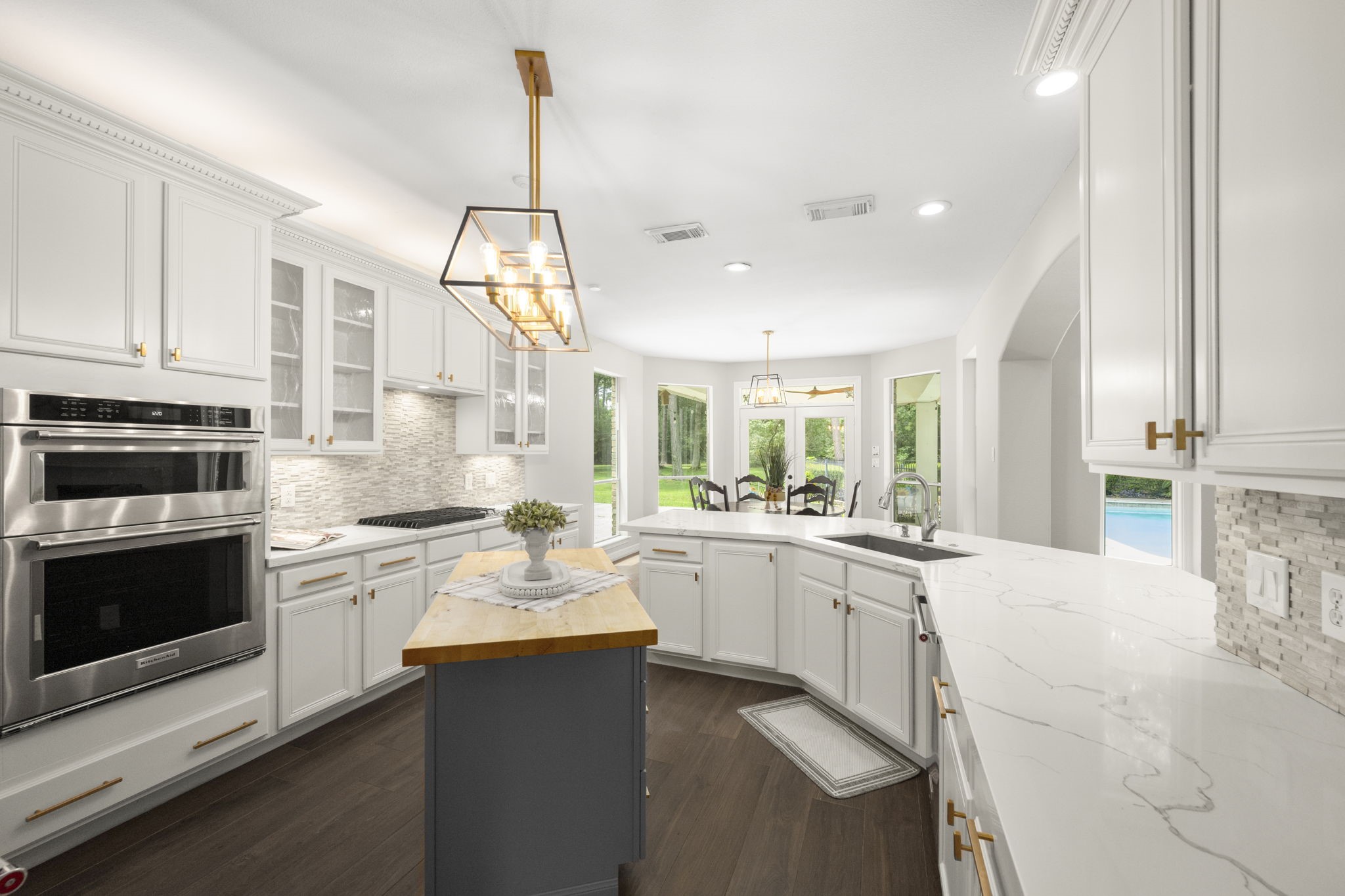 2326 Timbergreen Circle Magnolia, TX 77355 - Photo 9 of 43 a kitchen with a stove a sink and a refrigerator