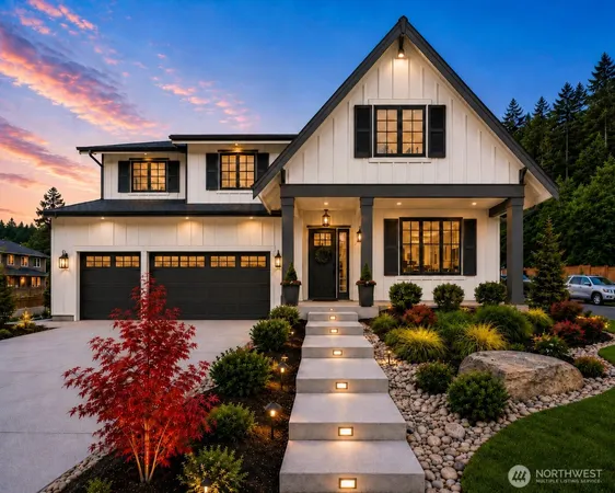 a front view of a house with a yard outdoor seating and mountain view