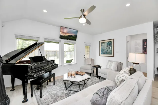a living room with furniture and a large window