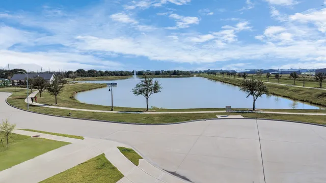 a view of a lake with a yard