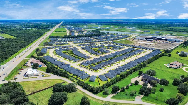 an aerial view of a house with a swimming pool