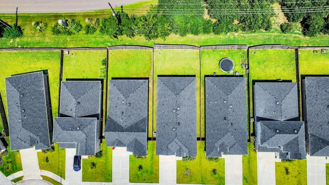 an aerial view of a house with a ocean view