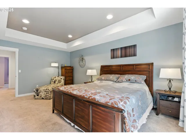 a bedroom with a bed and dresser