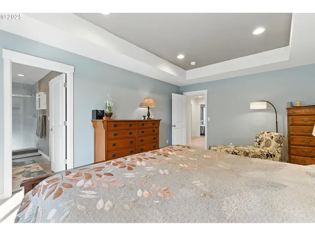 a bedroom with a bed and a dresser