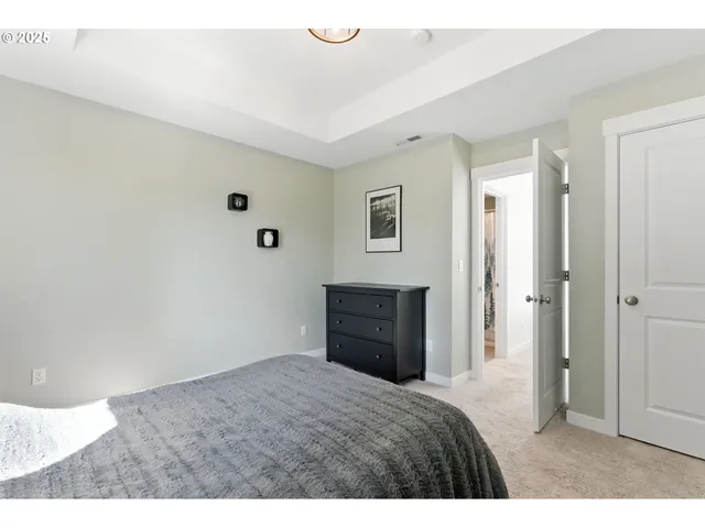 a bedroom with a bed and a view of bathroom