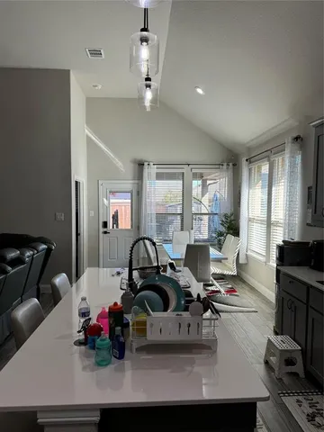 a living room with furniture a window and gym equipment
