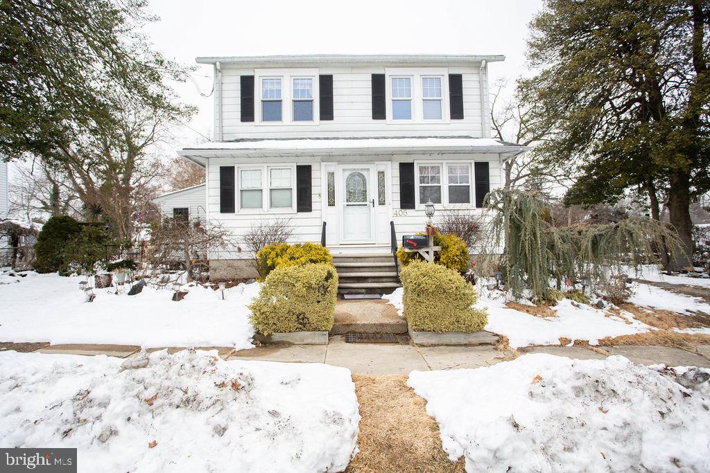 406 Walnut Avenue Laurel Springs, NJ 08021 - Photo 1 of 20 a view of a house with snow on the road