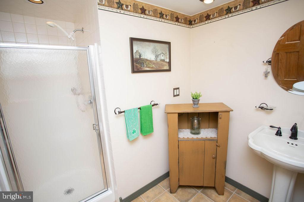 406 Walnut Avenue Laurel Springs, NJ 08021 - Photo 17 of 20 a bathroom with a sink and mirror