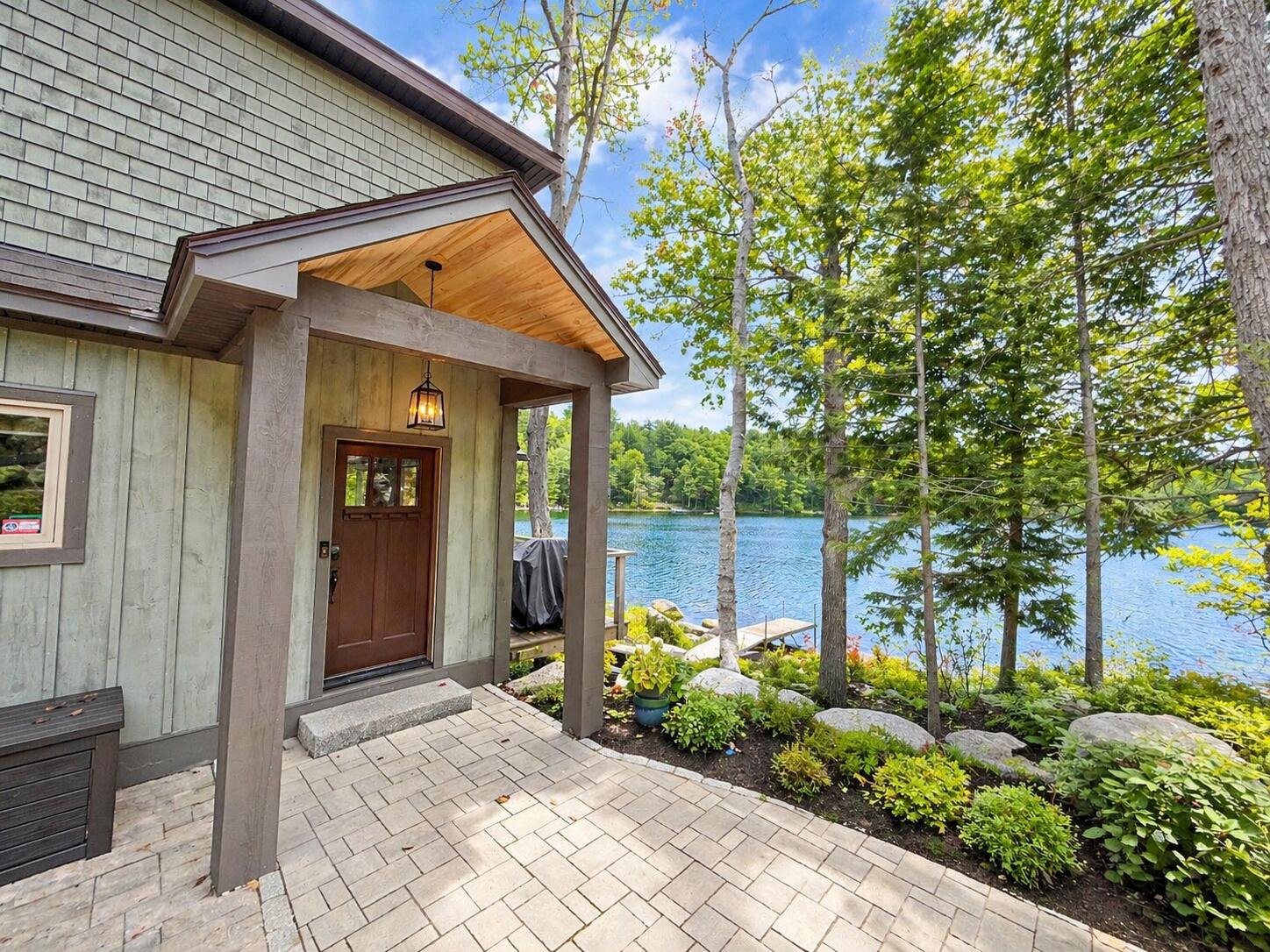 80 Fitts Mountain Road Dedham, ME 04429 - Photo 9 of 53 front of home beautifully landscaped