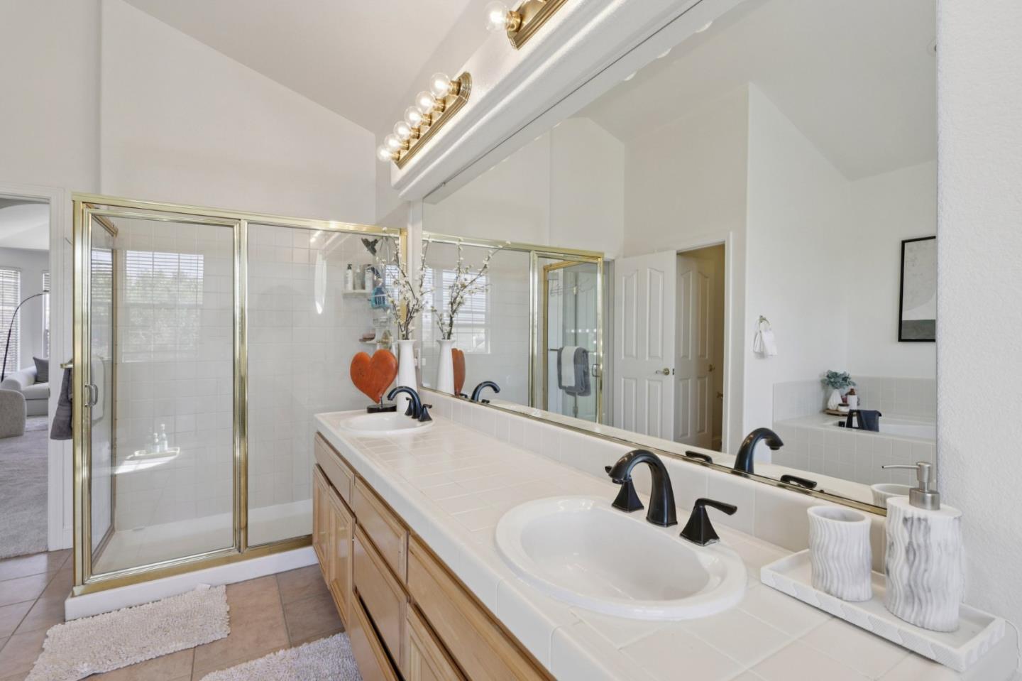 2276 Bentley Ridge Drive San Jose, CA 95138 - Photo 26 of 55 a bathroom with a sink and mirror