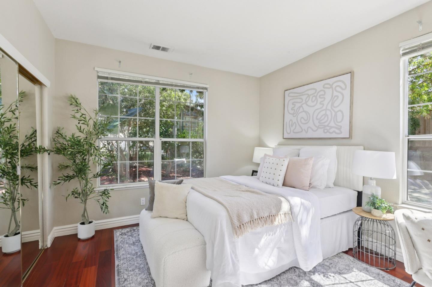 2276 Bentley Ridge Drive San Jose, CA 95138 - Photo 27 of 55 a spacious bedroom with a bed and a wooden floor