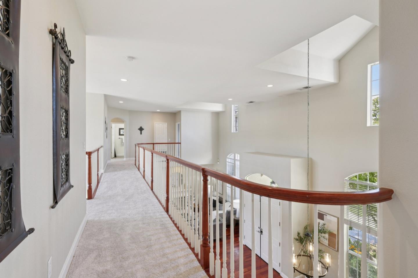 2276 Bentley Ridge Drive San Jose, CA 95138 - Photo 41 of 55 a view of a hallway with wooden floor and windows