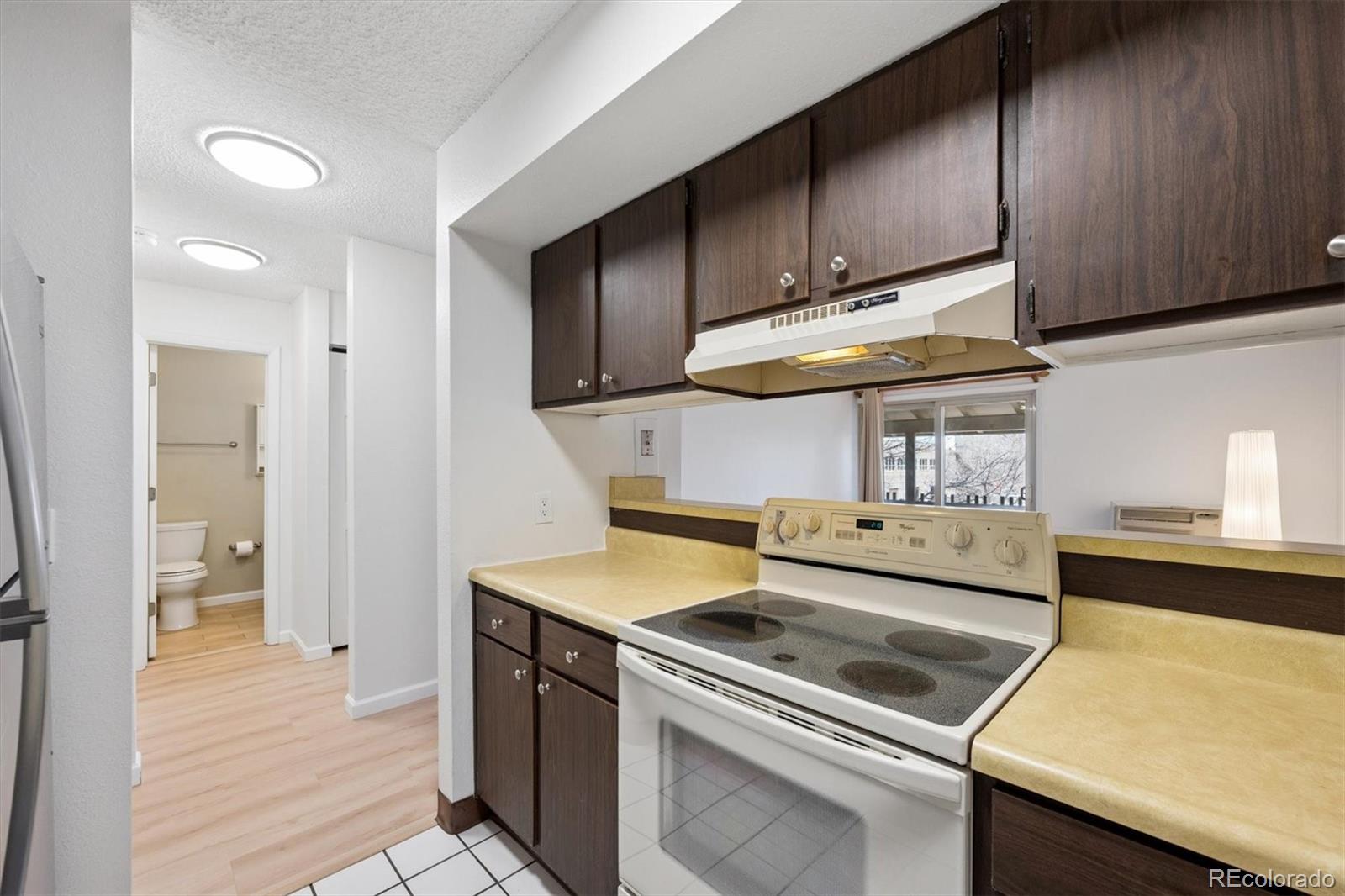2707 Valmont Road, Unit 312D Boulder, CO 80304 - Photo 12 of 48 a kitchen with a stove and a sink