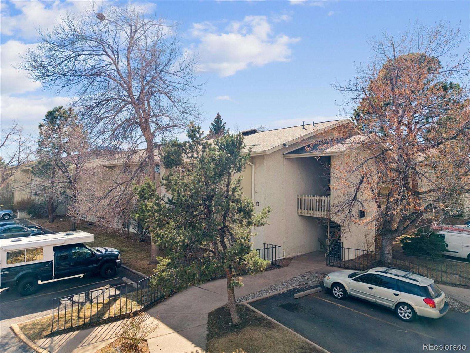 2707 Valmont Road, Unit 312D Boulder, CO 80304 - Photo 2 of 48 a car parked beside a road next to a building