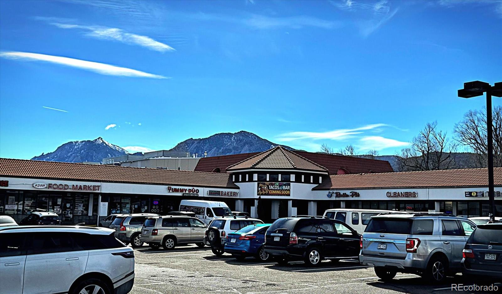 2707 Valmont Road, Unit 312D Boulder, CO 80304 - Photo 45 of 48 a car parked in front of a cars parked in front of a building