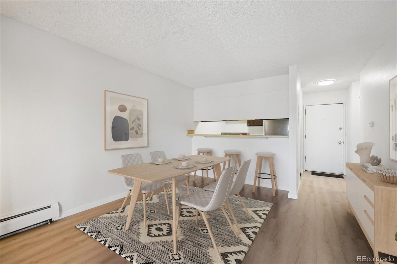 2707 Valmont Road, Unit 312D Boulder, CO 80304 - Photo 5 of 48 a view of a dining room with furniture and wooden floor