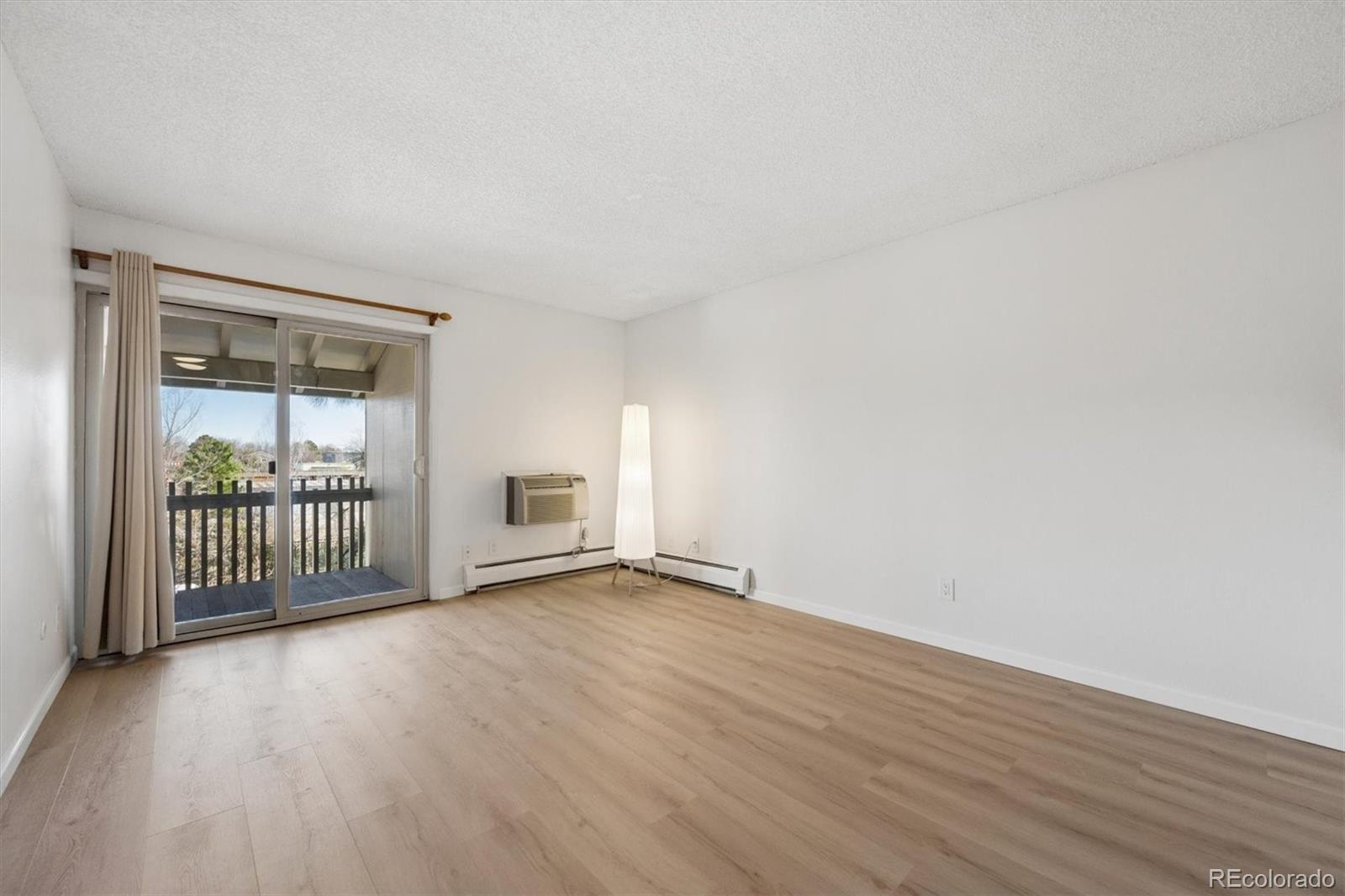 2707 Valmont Road, Unit 312D Boulder, CO 80304 - Photo 6 of 48 a view of a room with wooden floor and a window