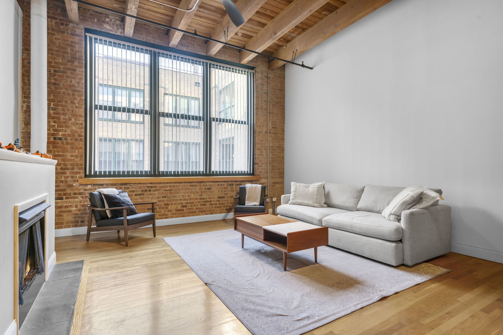 1727 South Indiana Avenue, Unit 320 Chicago, IL 60616 - Photo 3 of 28 a living room with furniture and a fireplace