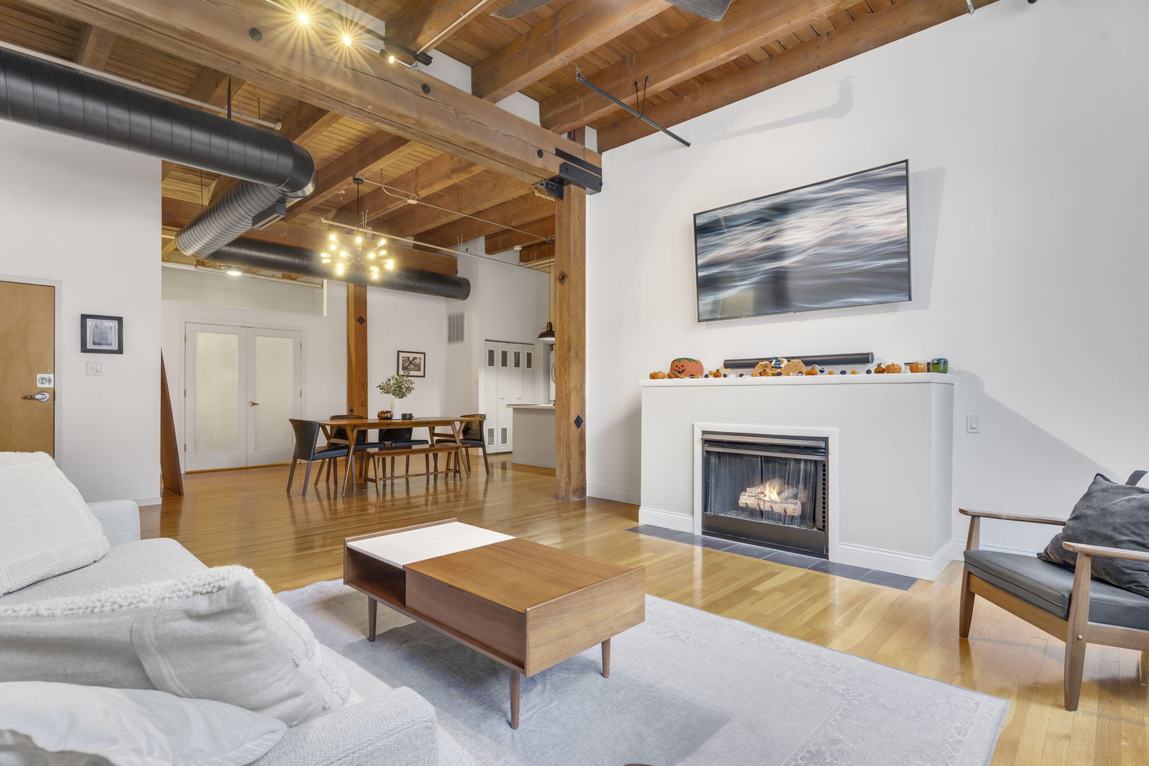 1727 South Indiana Avenue, Unit 320 Chicago, IL 60616 - Photo 5 of 28 a living room with furniture and a fireplace