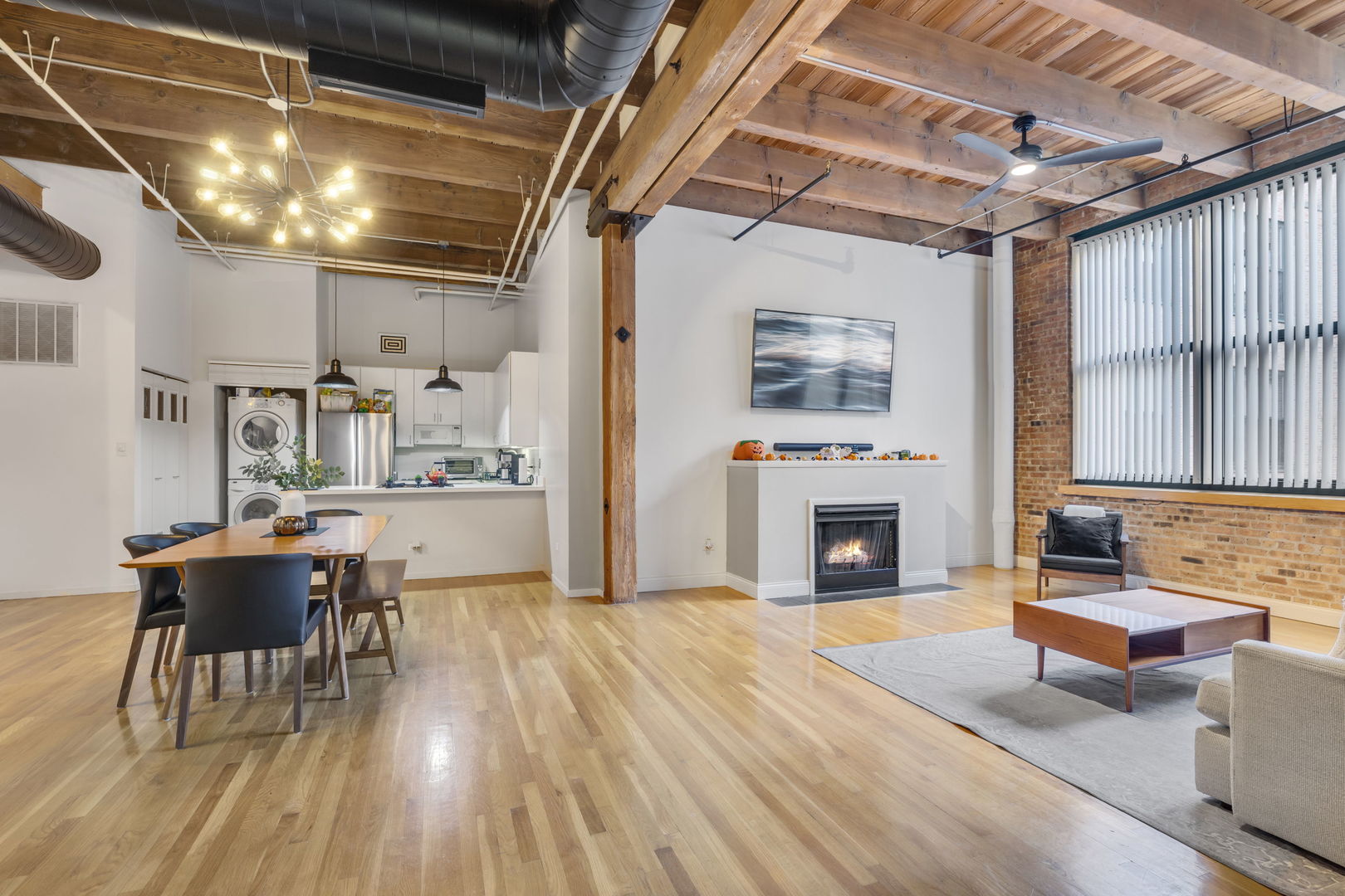1727 South Indiana Avenue, Unit 320 Chicago, IL 60616 - Photo 6 of 28 a view of a dining room with furniture window and wooden floor