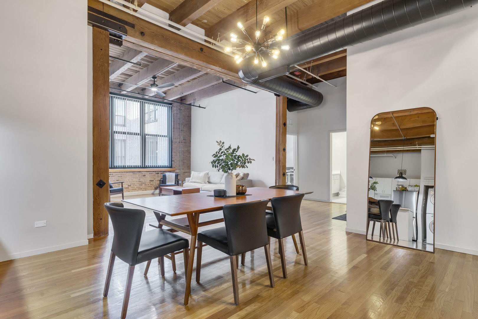 1727 South Indiana Avenue, Unit 320 Chicago, IL 60616 - Photo 9 of 28 a view of a dining room with furniture and wooden floor