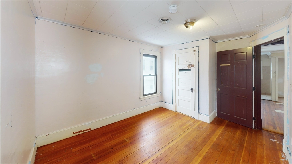 1403 Worcester Street Springfield, MA 01151 - Photo 13 of 23 a view of an empty room with wooden floor