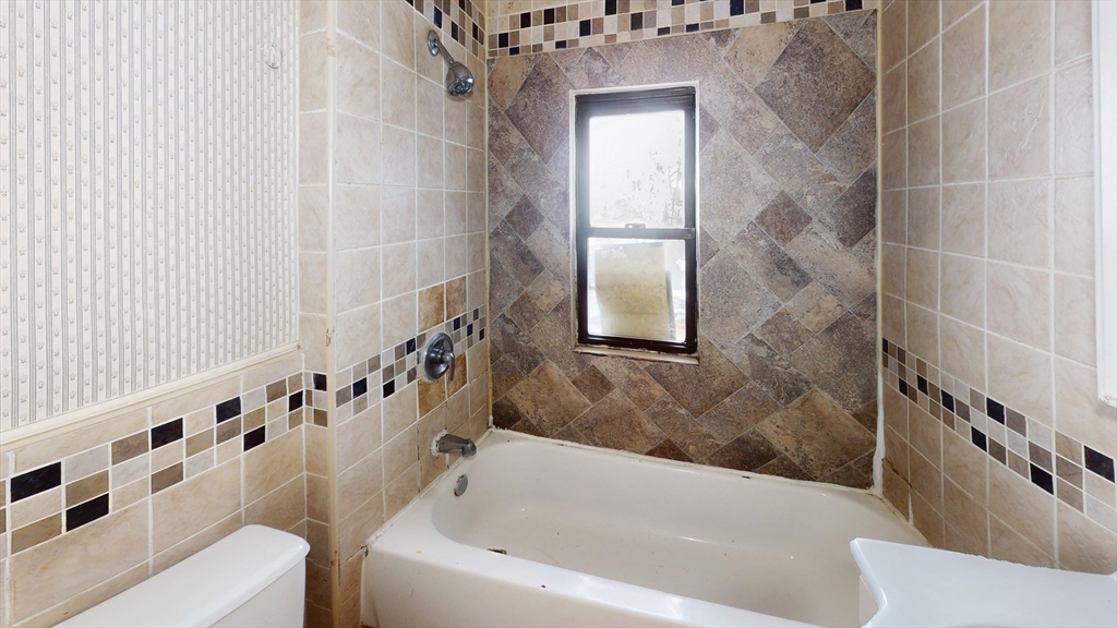 1403 Worcester Street Springfield, MA 01151 - Photo 17 of 23 a bathroom with a bathtub and shower