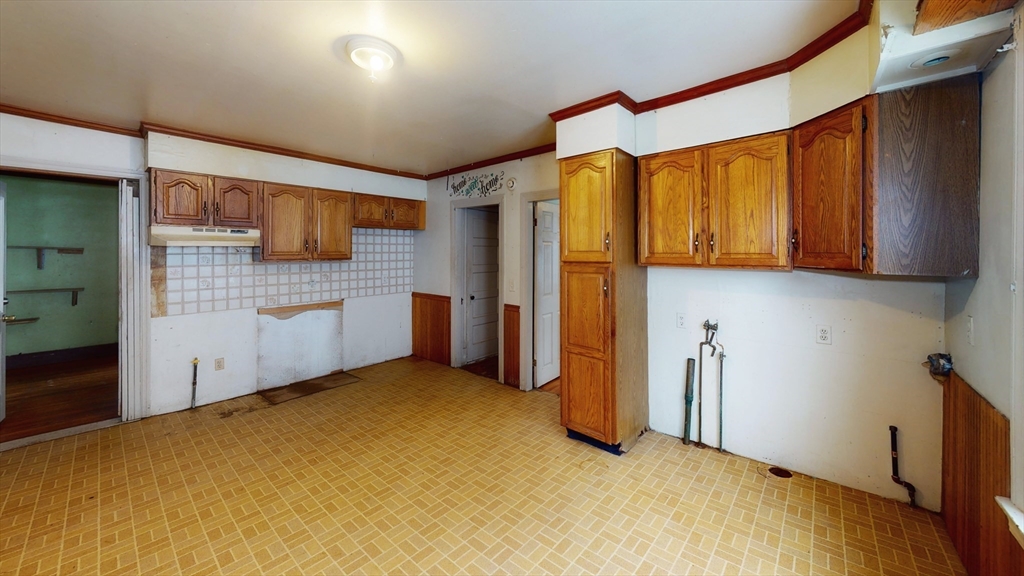 1403 Worcester Street Springfield, MA 01151 - Photo 6 of 23 a view of a kitchen with refrigerator and cabinet