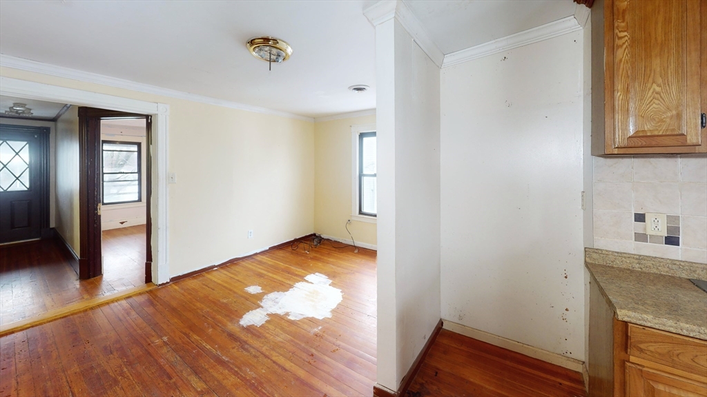 1403 Worcester Street Springfield, MA 01151 - Photo 7 of 23 a view of empty room with wooden floor and fan